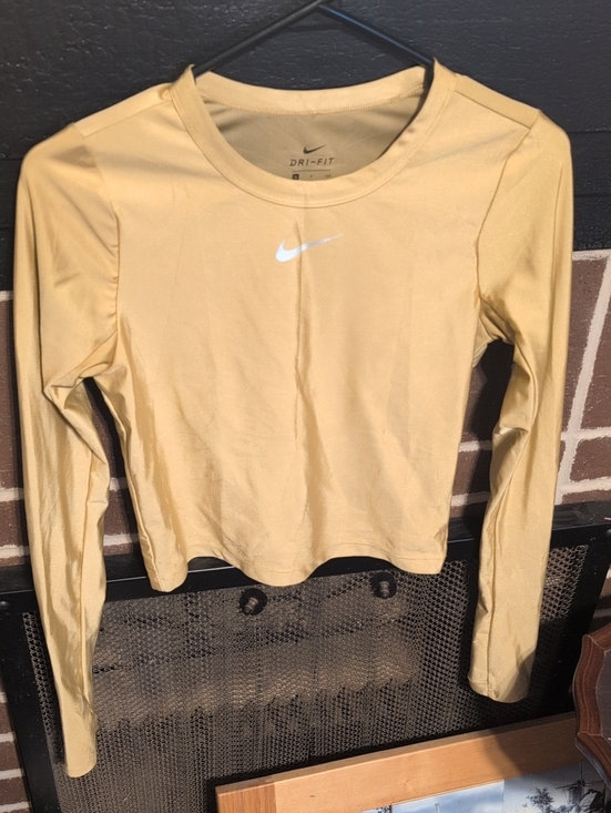 Nike Tops - Nike Long Sleeve Crop Top in Gold with White Swoosh